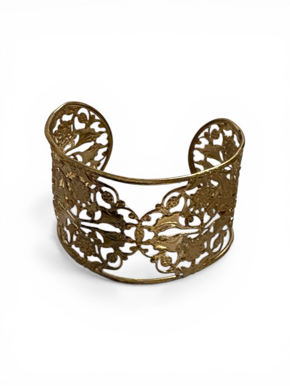 Bracelet gold-tone wide cuff with a floral openwork filigree design.